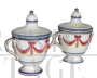 Pair of 18th century glazed terracotta spice jars with festoons