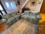Pair of Poltrona Frau sofas in sky blue leather                            
