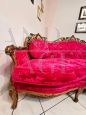 Sicilian Baroque style corner sofa in gilded wood and red velvet