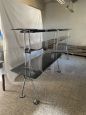 Nomos table and shelves by Tecno
