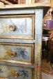 Antique chest of drawers from the 17th century painted with gold leaf