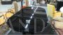 Large vintage black table with glass top and marble base