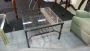 Industrial style coffee table with glass top