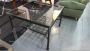 Industrial style coffee table with glass top