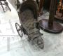 Antique toy stroller pram from the 19th century