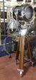 Vintage industrial spotlight with wooden tripod