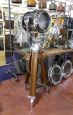 Vintage industrial spotlight with wooden tripod