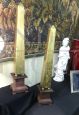 Pair of gilded wooden obelisks with porphyry effect base