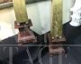 Pair of gilded wooden obelisks with porphyry effect base