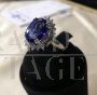White gold ring with diamonds and large central tanzanite                