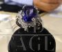 White gold ring with diamonds and large central tanzanite            