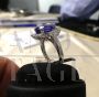 White gold ring with diamonds and large central tanzanite