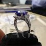 White gold ring with diamonds and large central tanzanite