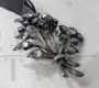 Antique brooch with a bouquet of flowers in gold and silver with diamonds and sapphire