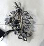 Antique brooch with a bouquet of flowers in gold and silver with diamonds and sapphire