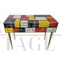 Colored glass and brass console with two drawers 