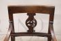 Antique Directoire armchair from the end of the 18th century in carved walnut