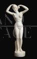 Antique sculpture in white statuary marble with a female subject