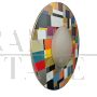 Large round mirror in multicolored glass