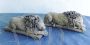   Pair of small sculptures of sleeping lions, inspired by Antonio Canova                          