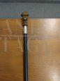 Wooden walking stick with resin and silver character