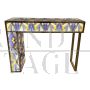 Asymmetric design console in backlit blue and gold glass