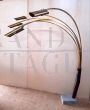 Reggiani style arched floor lamp in brass