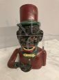 Vintage hand-painted cast iron piggy bank with mechanism