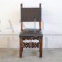 Antique chair in carved walnut and brown leather