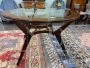 Mid-century round wooden table with glass top