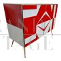 Sideboard with white and red glass geometries