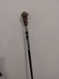 Wooden walking stick with resin and silver character    