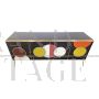 Backlit sideboard in black glass with colored circles