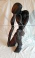 African ethnic sculpture with figure in black stained teak wood