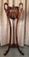 Art deco wooden plant stand with carved swans