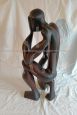 African ethnic sculpture with figure in black stained teak wood