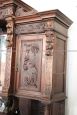 Imposing antique cupboard in carved solid walnut with mirror, 19th century