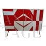 Sideboard with white and red glass geometries