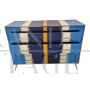 Dresser with 4 drawers covered in blue, white and yellow glass