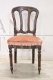 Antique single chair from the 19th century covered in peach colored velvet