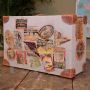 Vintage suitcase in beige fabric and brown leather with travel stickers