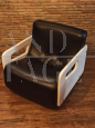 Rare Space Age armchair in black leather and wood