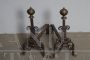 Antique pair of fireplace andirons in iron and brass from the 18th century