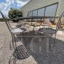 Garden set with 6 chairs and a large wrought iron table