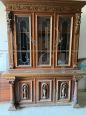 Living room set with buffet & hutch cupboard and a sideboard, all carved with statues