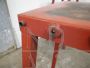 Industrial trestle table in red lacquered iron, 1960s