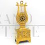 Antique Parisian Empire lyre clock in gilded bronze from the 19th century