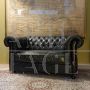 English green Chesterfield sofa