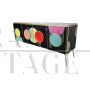 Backlit four-door sideboard with colored glass circles