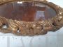 Oval mirror frame in carved and gilded wood, early 20th century